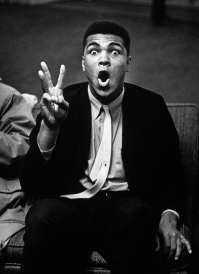 PITTSBURGH - January 1963: Boxing heavyweight contender Cassius Clay (now Muhammad Ali) holding up three fingers while reciting poem predicting that opponent Charlie Powell will fall in third round. (Photo by Marvin Lichtner/Pix Inc./The LIFE Images Collection/Getty Images)