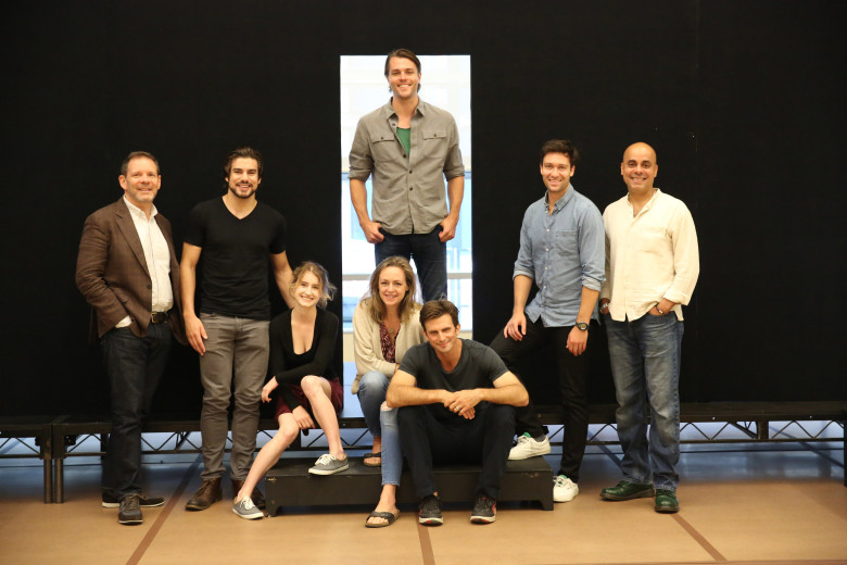L-R: Cast members Thomas Jay Ryan, Alex Esola, Catherine Combs, Andrus Nichols, Dave Register, Frederick Weller (seated), Danny Binstock and Howard W. Overshown during rehearsal for the Young Vic production of “A View From the Bridge.”