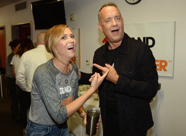 actors Kristen Wiig (L) and Tom Hanks attend Stand Up To Cancer