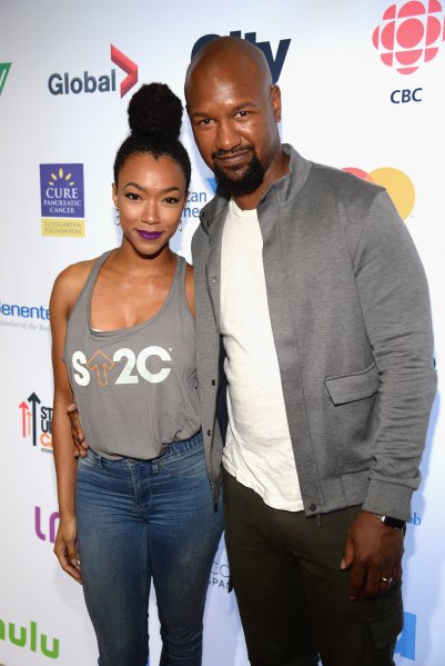 actors Sonequa Martin-Green (L) and Kenric Green attend Stand Up To Cancer