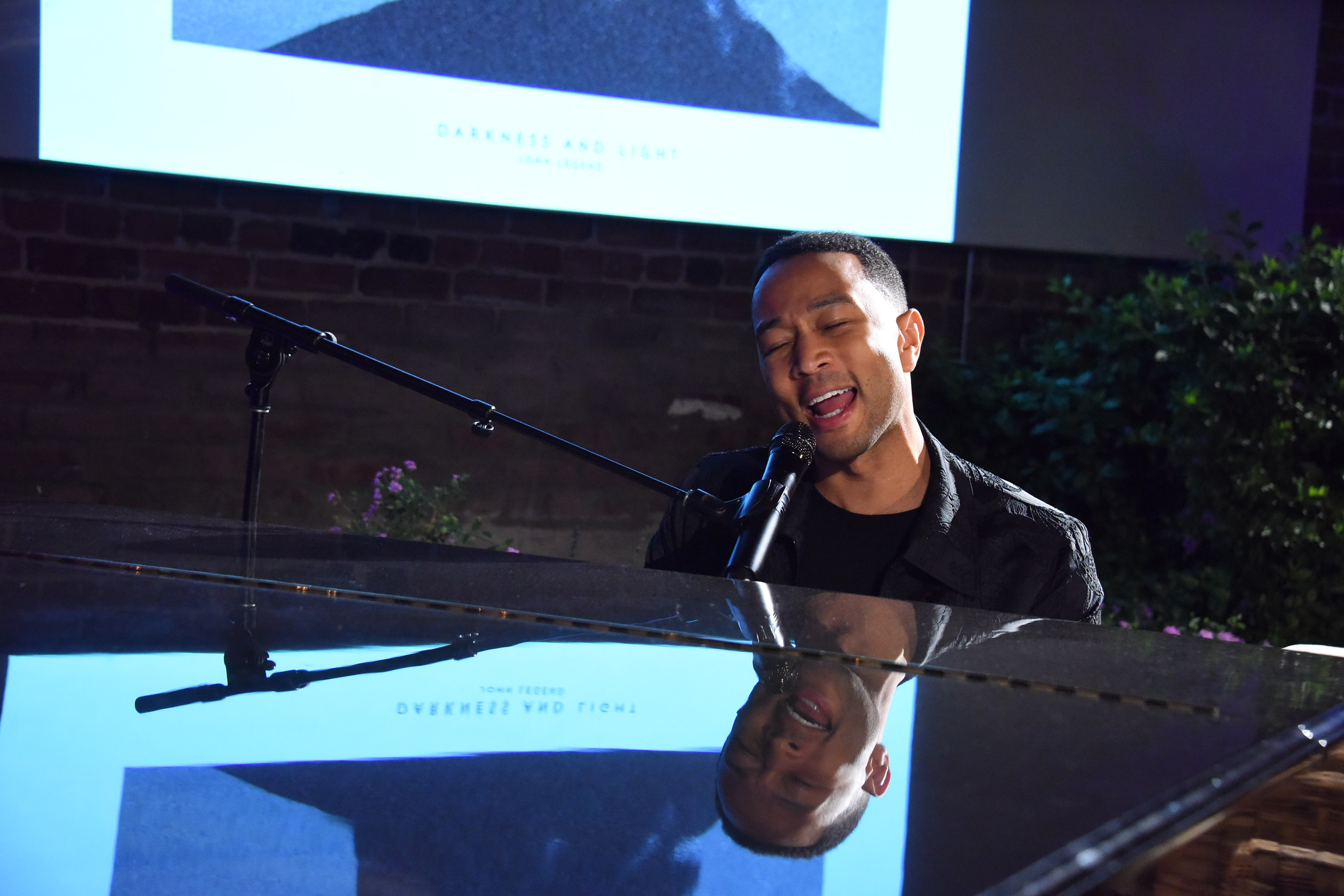 LOS ANGELES, CA - NOVEMBER 16:  John Legend performs at The Underground Museum for Belvedere DARKNESS AND LIGHT listening event on November 16, 2016 in Los Angeles, California.  (Photo by Araya Diaz/Getty Images for Columbia Records)