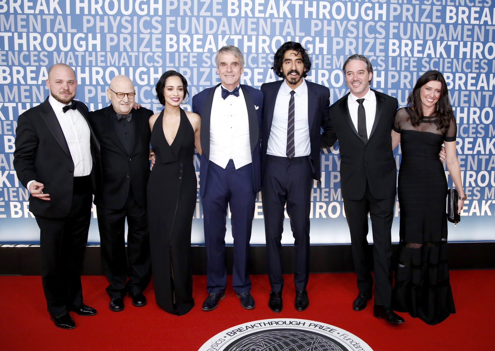  (L-R) Filmmakers Sam Pressman and Ed Pressman, actors Devika Bhise, Jeremy Irons, Dev Patel, Writer-Director Matt Brown, and artist Melissa Herrington attend the 2017 Breakthrough Prize at NASA Ames Research Center on December 4, 2016 in Mountain View, California.  (Photo by Kimberly White/Getty Images for Breakthrough Prize)
