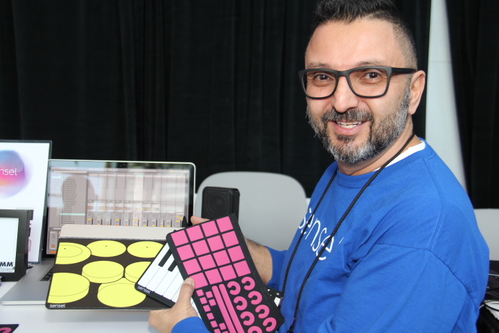 Reuben Martinez, Senior Lab/Process Engineer, Sensel, holding unique Morph overlays. 