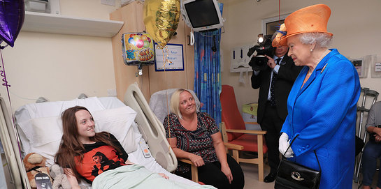 The Queen speaks to Millie Robson, aged 15, from County Durham, and her mum, Marie at Royal Manchester Children's Hospital