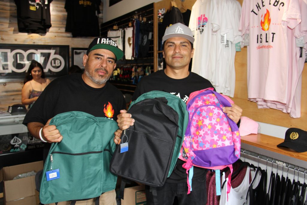 (Lto R) Long Beach Homegrown Brand founder Dire One with the Hood Santa inside the 1897 Brand Store (Photo by: Fredwill Hernandez/ The Hollywood 360) 