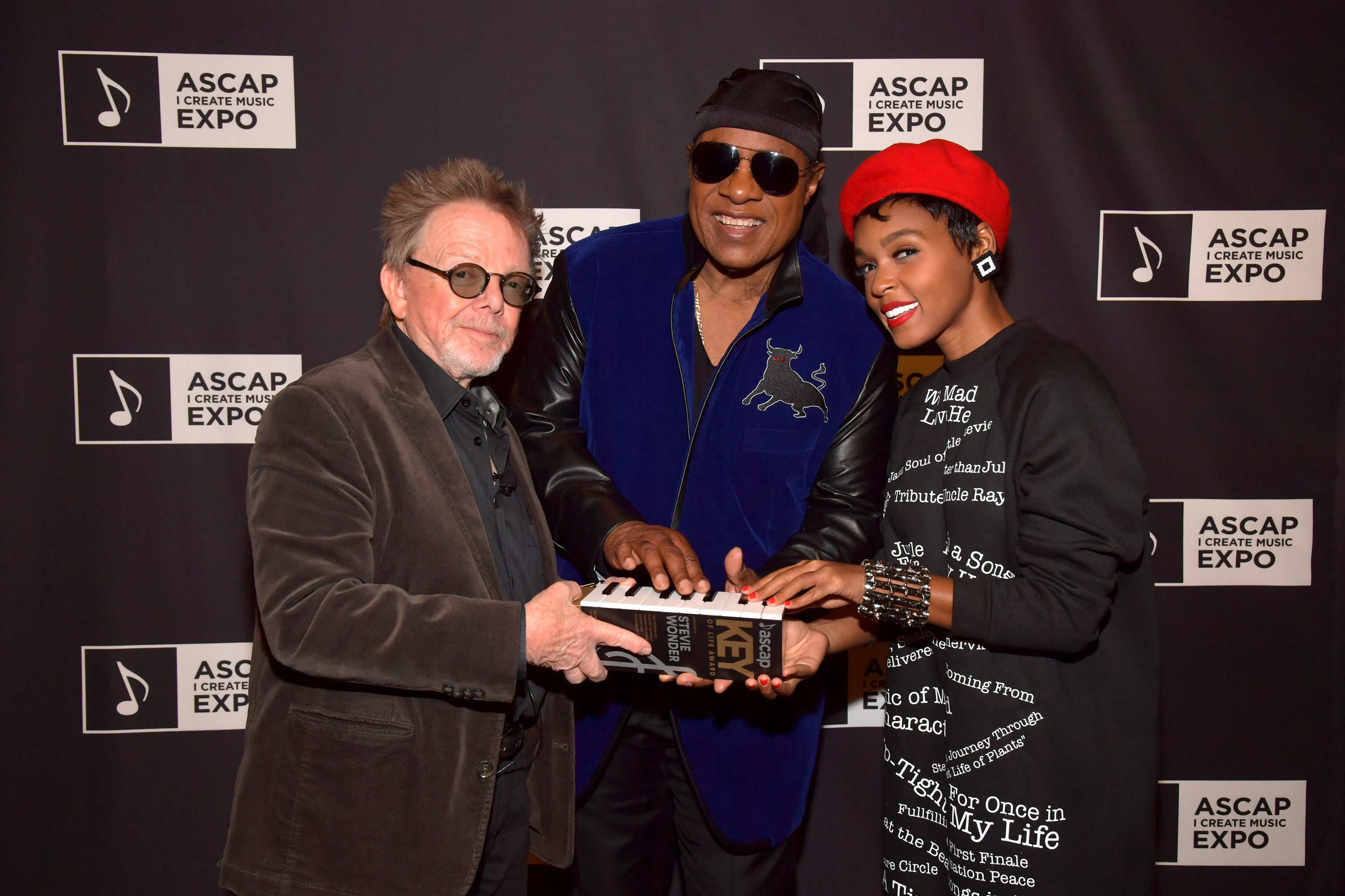 LOS ANGELES, CA - APRIL 15:  (L-R) ASCAP President Paul Williams and musicians Stevie Wonder and Janelle Monae attend Stevie Wonder presented with "Key of Life" Award at the ASCAP "I Create Music" Expo on April 15, 2017 in Los Angeles, California.  (Photo by Lester Cohen/Getty Images for ASCAP )