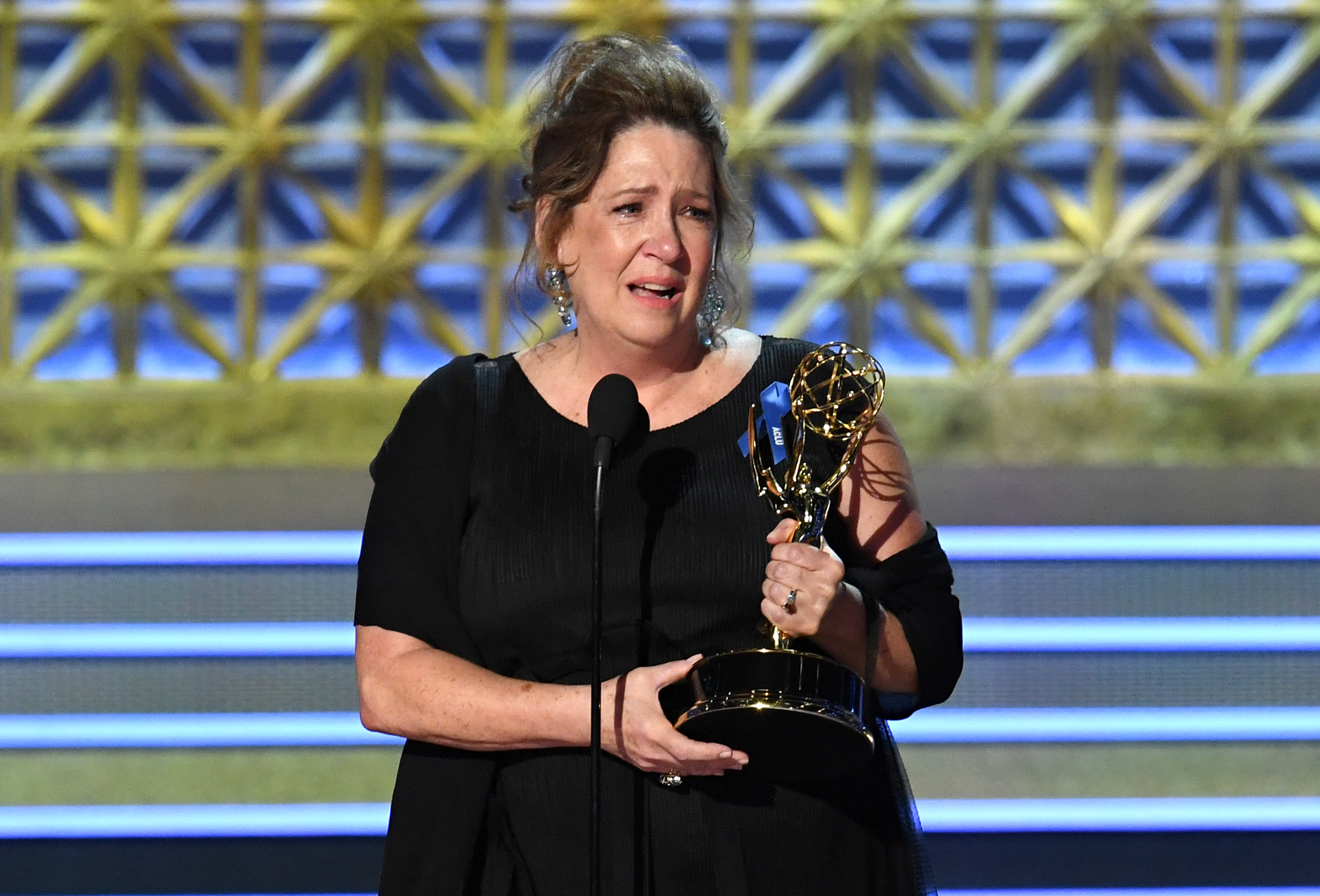 LOS ANGELES, CA - SEPTEMBER 17:  Actor Ann Dowd accepts Outstanding Supporting Actress in a Drama Series for "The Handmaid's Tale" onstage during the 69th Annual Primetime Emmy Awards at Microsoft Theater on September 17, 2017 in Los Angeles, California.  (Photo by Kevin Winter/Getty Images)