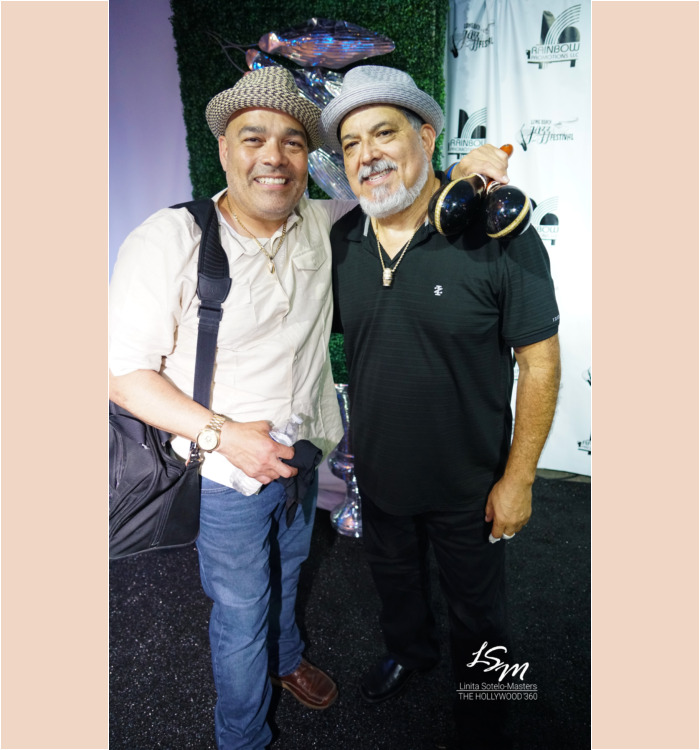 Poncho Sanchez backstage with his son.